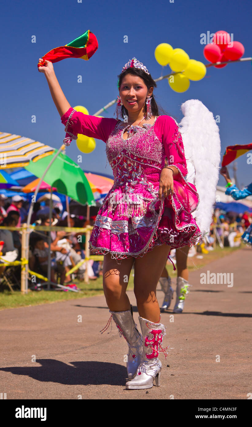 MANASSAS, VIRGINIA, USA - Woman with angel wings during Bolivian folklife festival parade with dancers in costume. Stock Photo