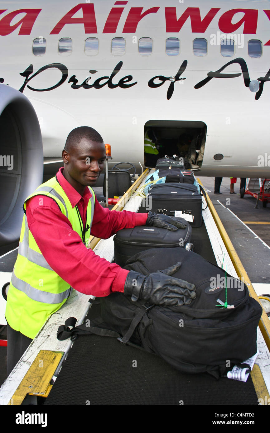 Kenya airways baggage handler  handling loading Stock Photo