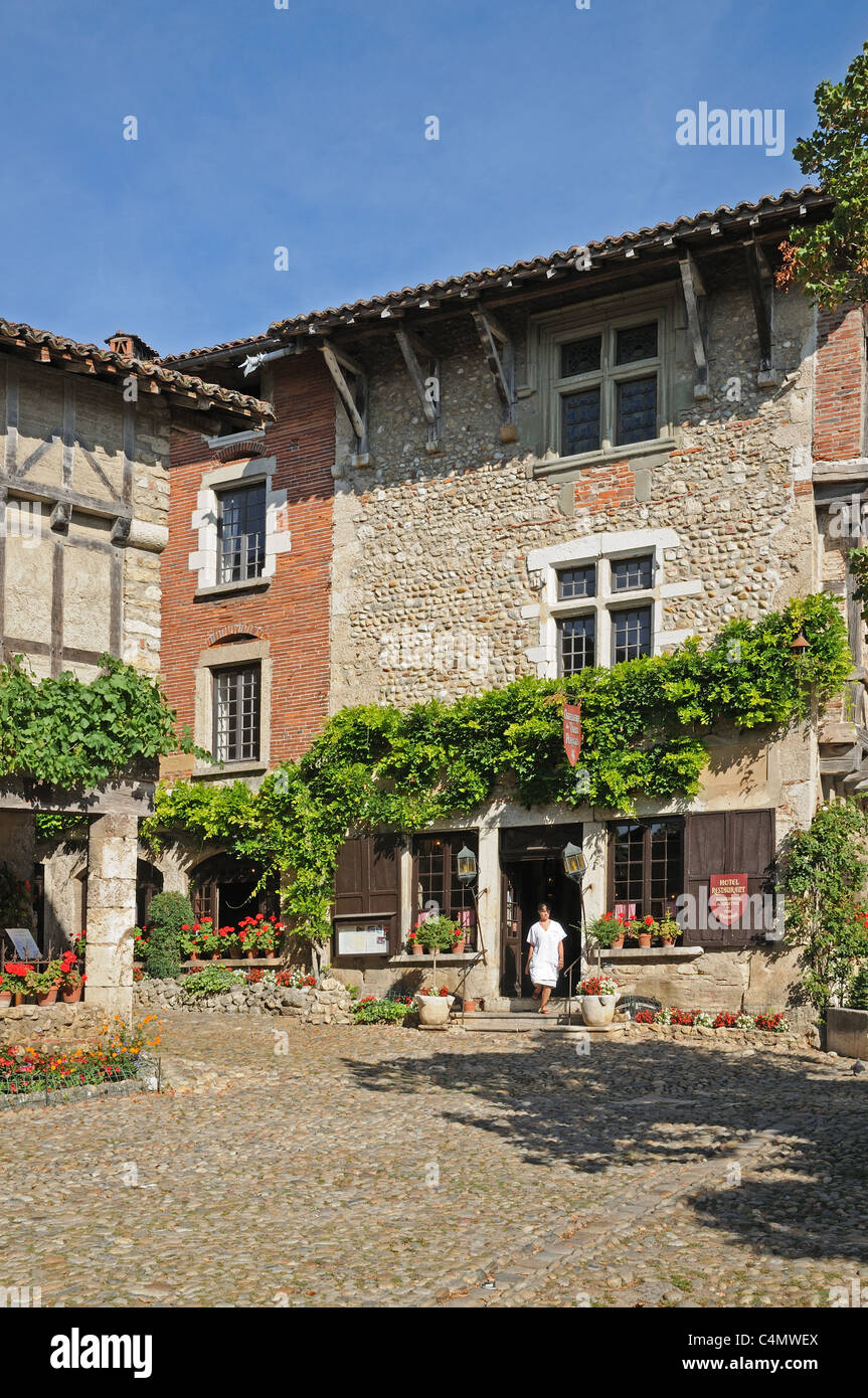 Hostellerie de Perouges with red geranium flowers Place du Tilleul Perouges Burgundy France Stock Photo