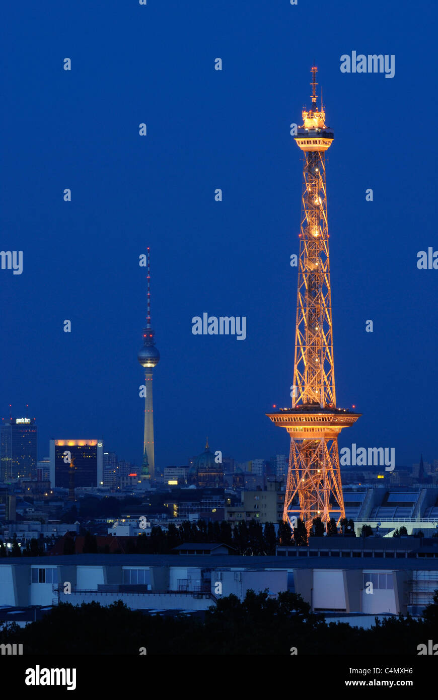Berlin from West to East: View from Mt. Teufelsberg on the skyline with radio tower and tv tower, Funkturm, Fernsehturm. Stock Photo