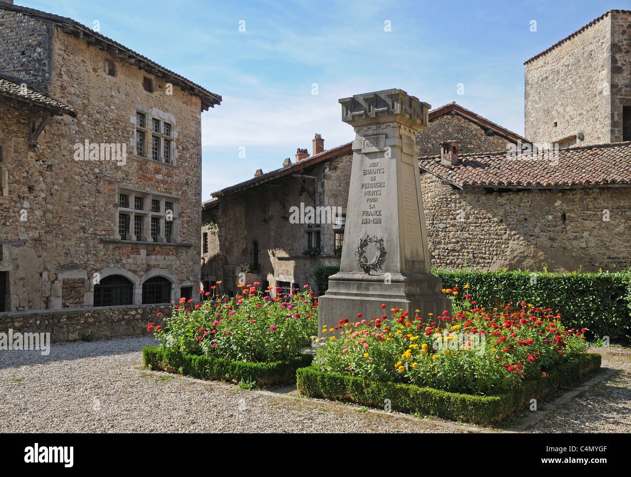 First World War Memorial Cenotaph with red and yellow flower beds ...