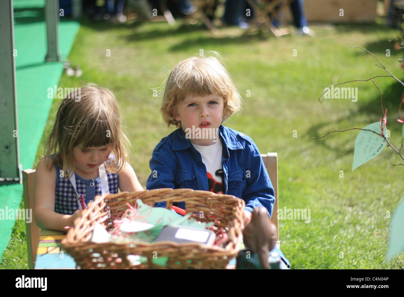 young brother and sister doing arts and crafts at the hay literary festival (shot with parents' permission of course!) Stock Photo