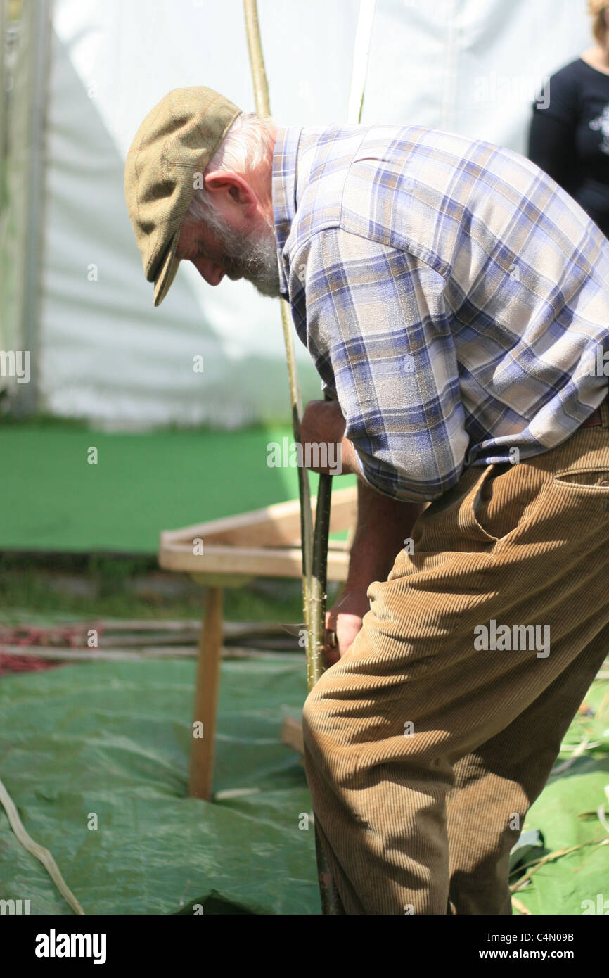 a man demonstrating the craft of hurdling, Hay Literary Festival, May 2011 Stock Photo