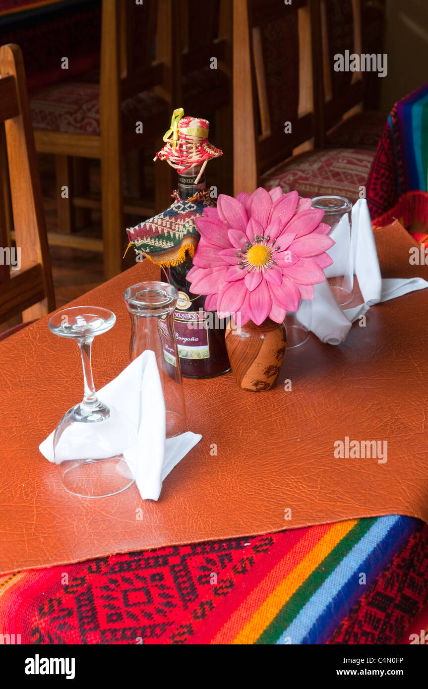 Colorful outdoor restaurant table settings and tablecloths in Agua Calientes, Peru. Stock Photo
