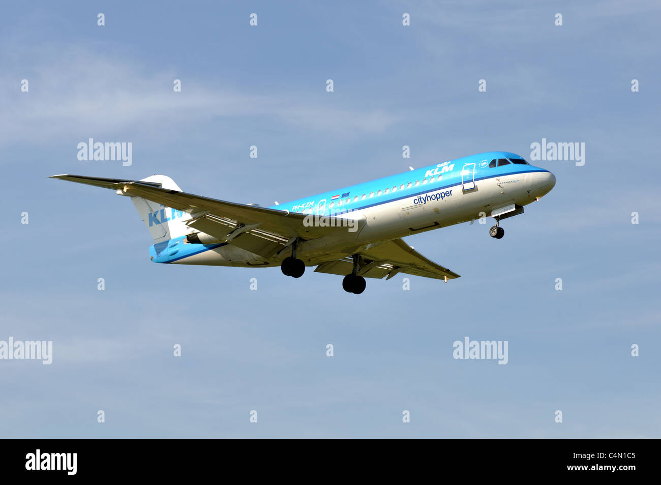 KLM Cityhopper Fokker 70 aircraft approaching Birmingham Airport, UK Stock Photo