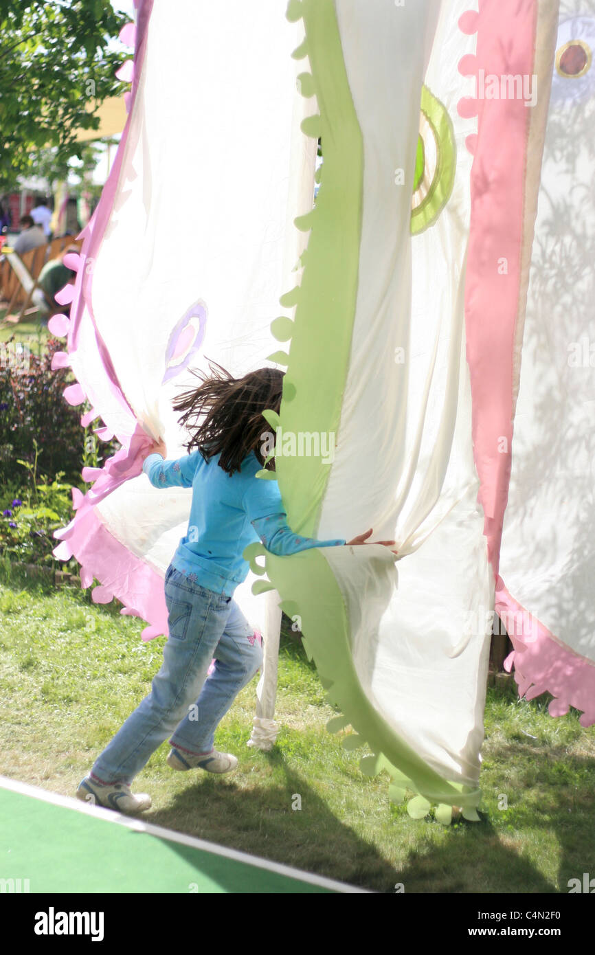 playing with the iconic flags in each of the corners of the quad at the Hay Literary Festival proved irresistable for the kids Stock Photo