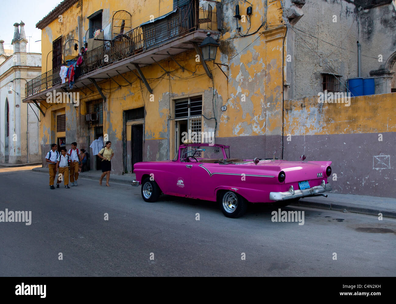 School children walk home along the streets of old town Havana, Cuba. Stock Photo