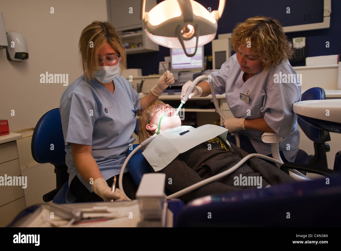 A teenage girl getting her teeth examined at a NHS National Health Service dentist UK Stock Photo