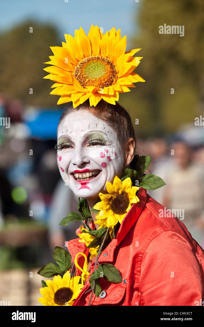 French clown with traditional whitepainted face at market in La Reole