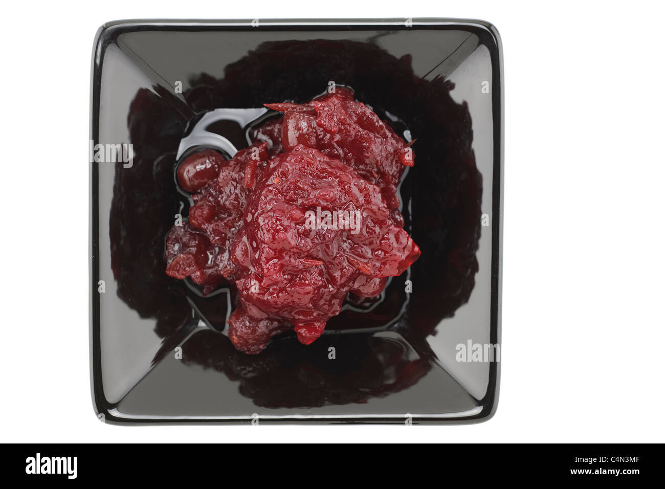 Cranberry sauce in a black serving dish Stock Photo