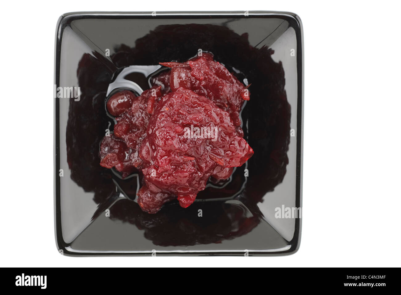 Cranberry sauce in a black serving dish Stock Photo Alamy