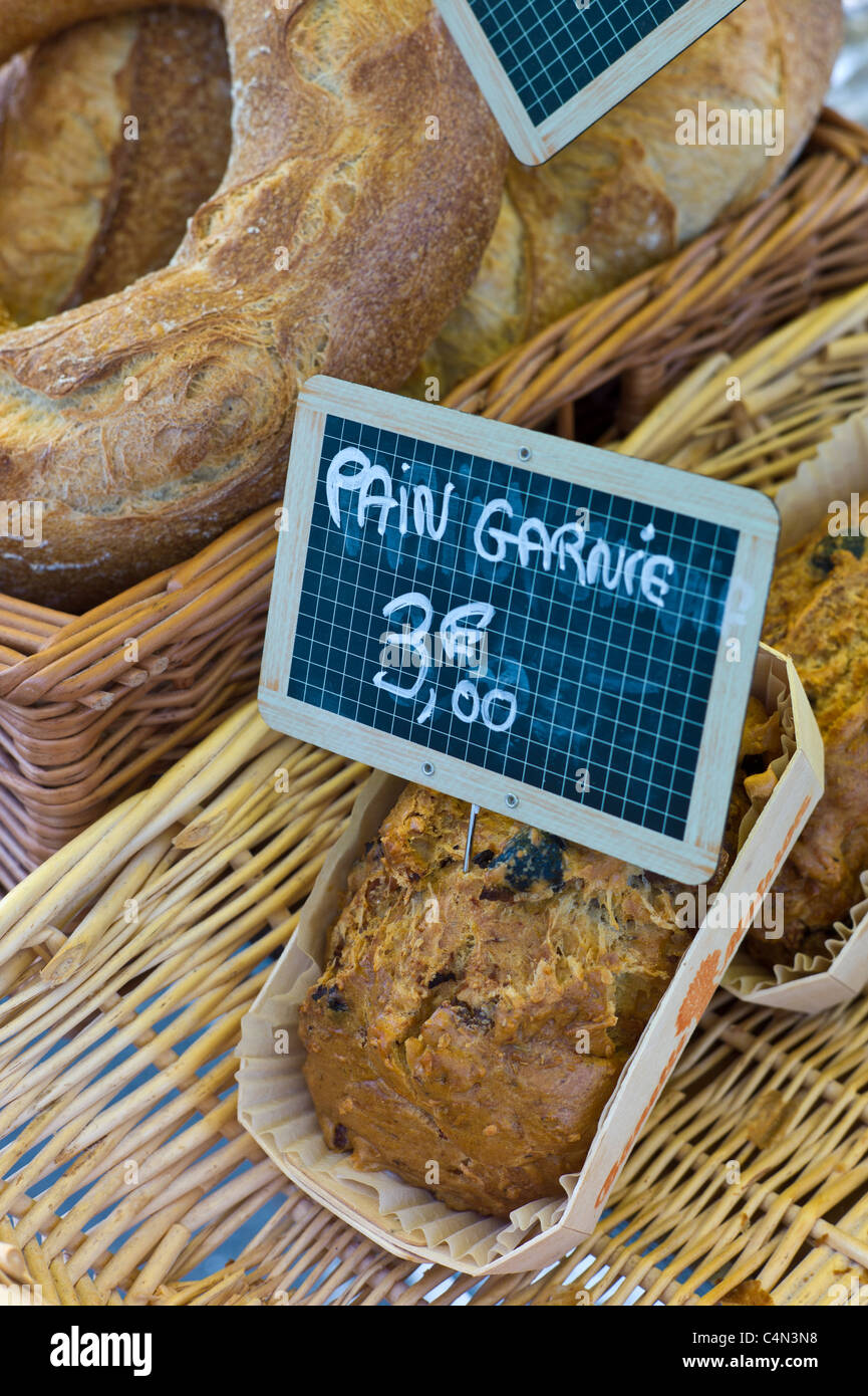 Fresh French bread, pain garnie, on sale for 3 euros at food market at La Reole in Bordeaux region of France Stock Photo