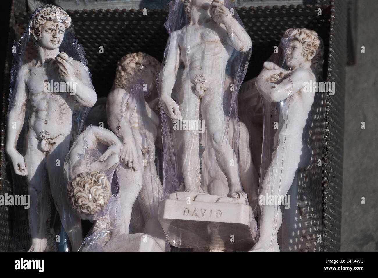 Small statues of Michelangelo's David wrapped in clear plastic for sale to tourists in Florence, Italy. Stock Photo