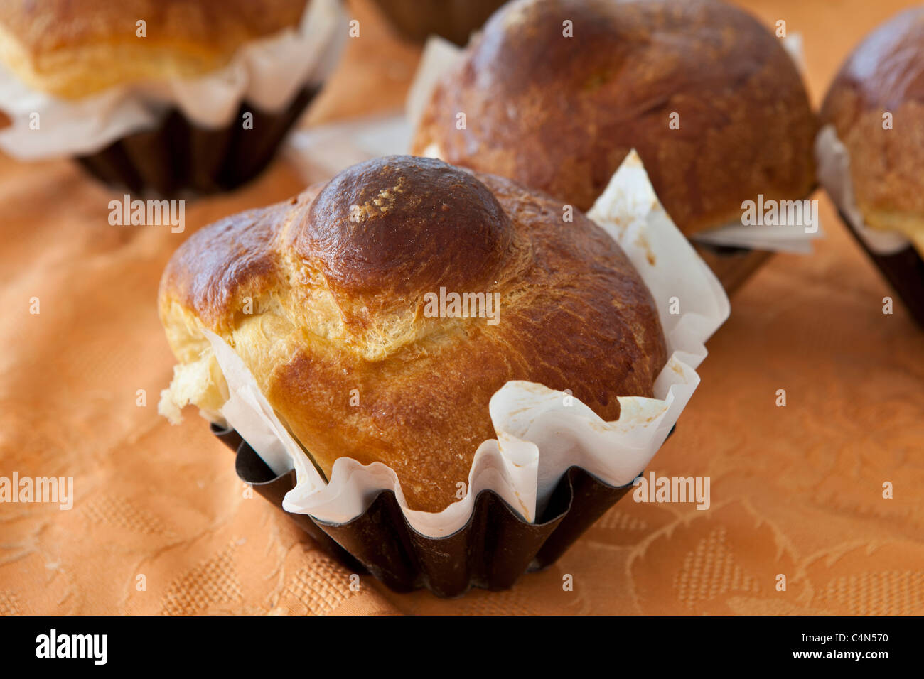Freshly-baked French brioche on sale at food market at La Reole in Bordeaux region of France Stock Photo