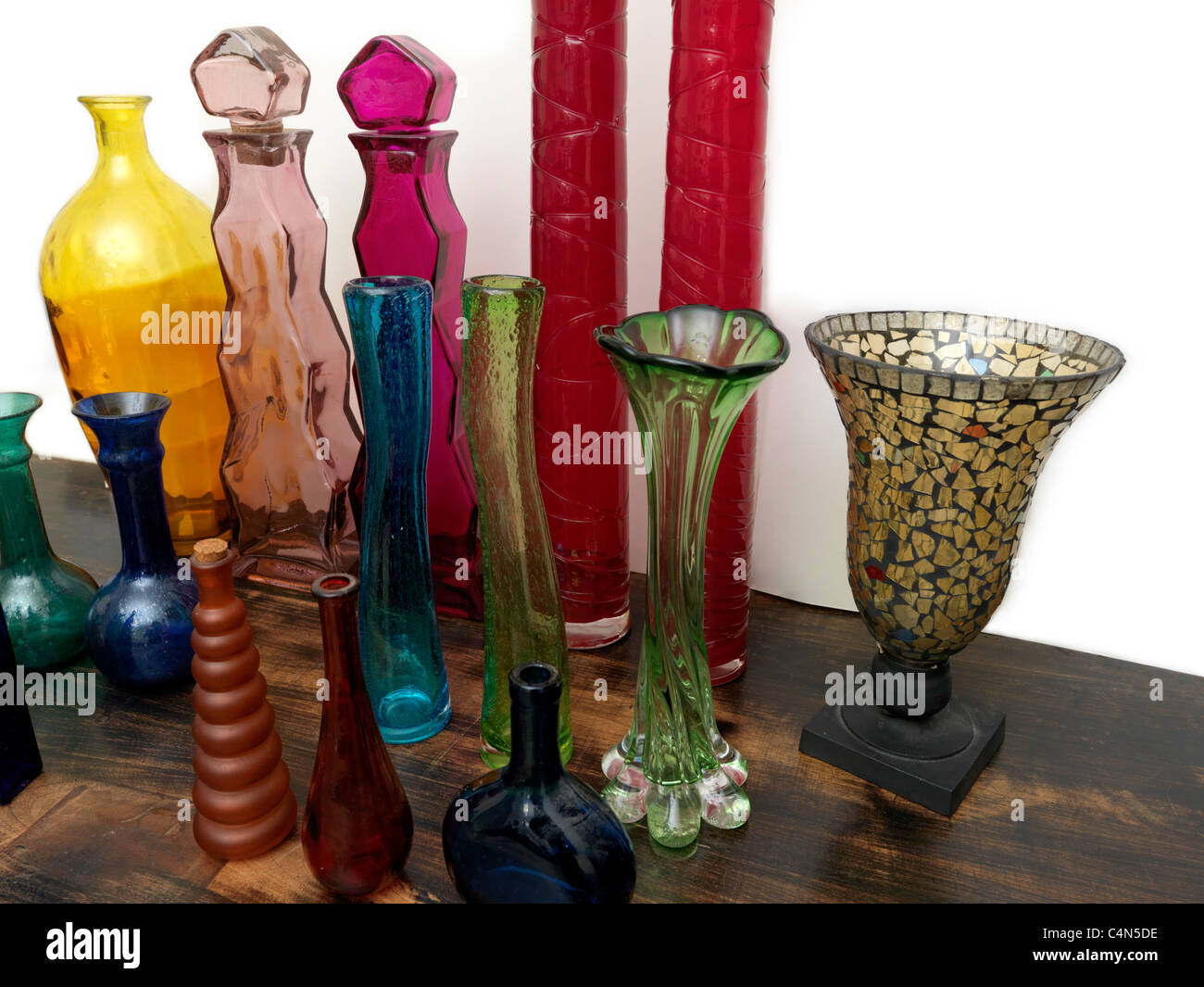 A Collection Different Coloured And Shapes Bottles And Vases Made From