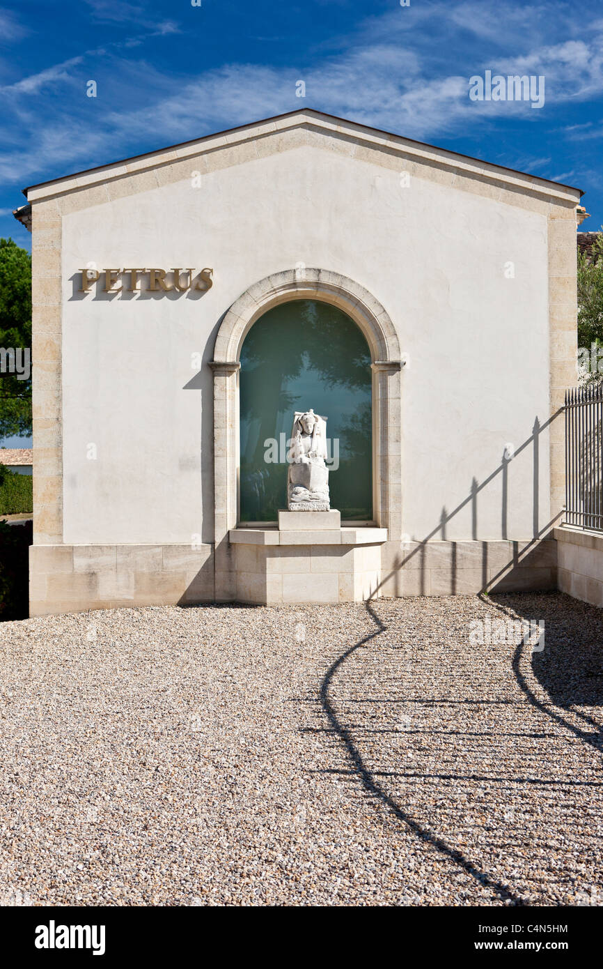 The famous Chateau Petrus wine estate, with statue of St Pierre, at Pomerol in the Bordeaux region of France Stock Photo