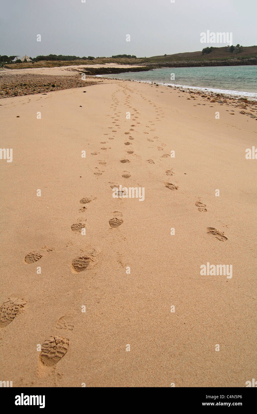 footsteps on the beach in the isles of scilly Stock Photo