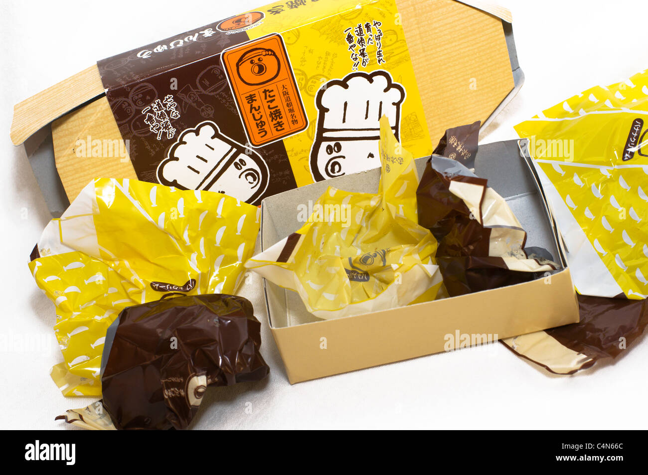 Empty wrappers and an open box are all that is left of this delicious Japanese dessert treat. Stock Photo