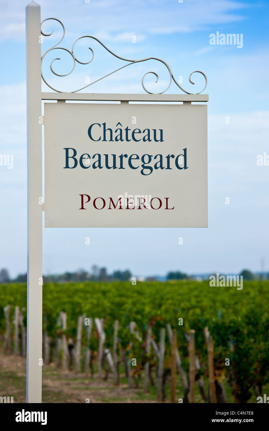Sign for Chateau Beauregard wine estate above vines at Pomerol in the