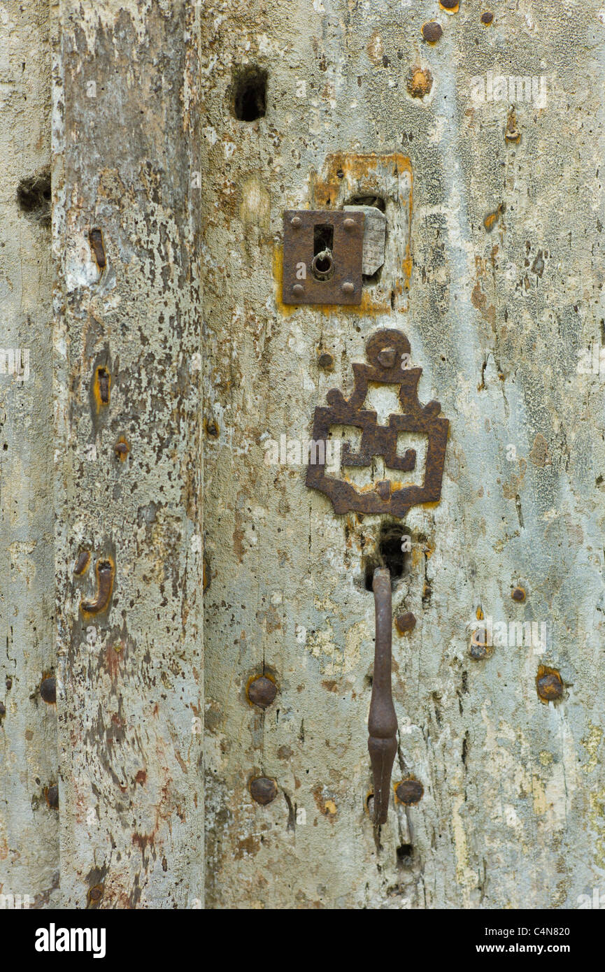 Traditional French lock in a doorway in quaint town of Castelmoron d'Albret in Bordeaux region, Gironde, France Stock Photo