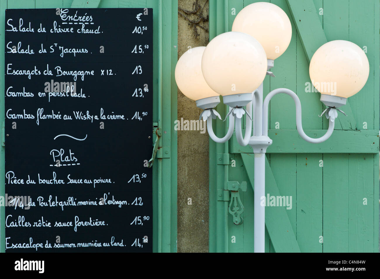 Traditional French Cafe menu of Entrees and Plats in quaint town of Castelmoron d'Albret in Bordeaux region, Gironde, France Stock Photo