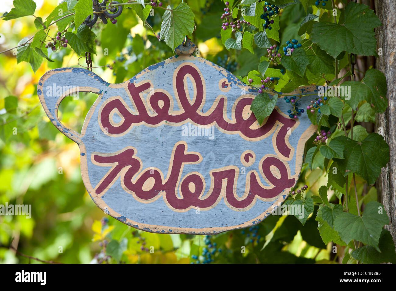 Pottery sign for craft shop in quaint town of Castelmoron d'Albret in Bordeaux region, Gironde, France Stock Photo