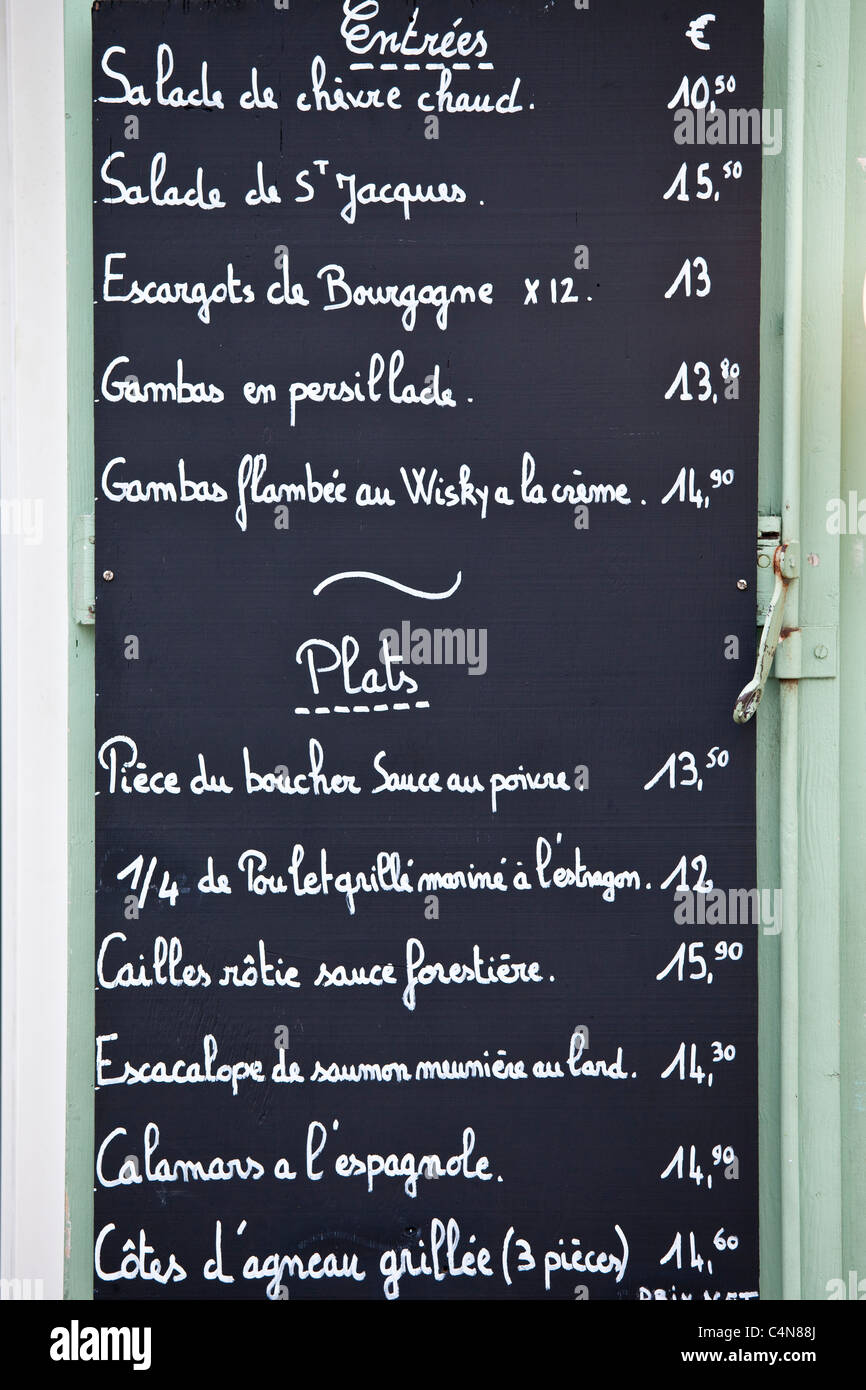 Traditional French Cafe menu of Entrees and Plats in quaint town of Castelmoron d'Albret in Bordeaux region, Gironde, France Stock Photo