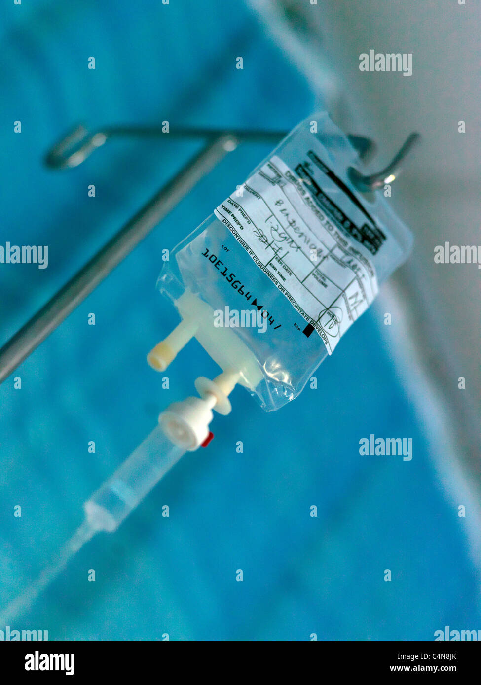 Intravenous Drip Sodium Chloride Infusion Hanging On Hook In Hospital Stock Photo