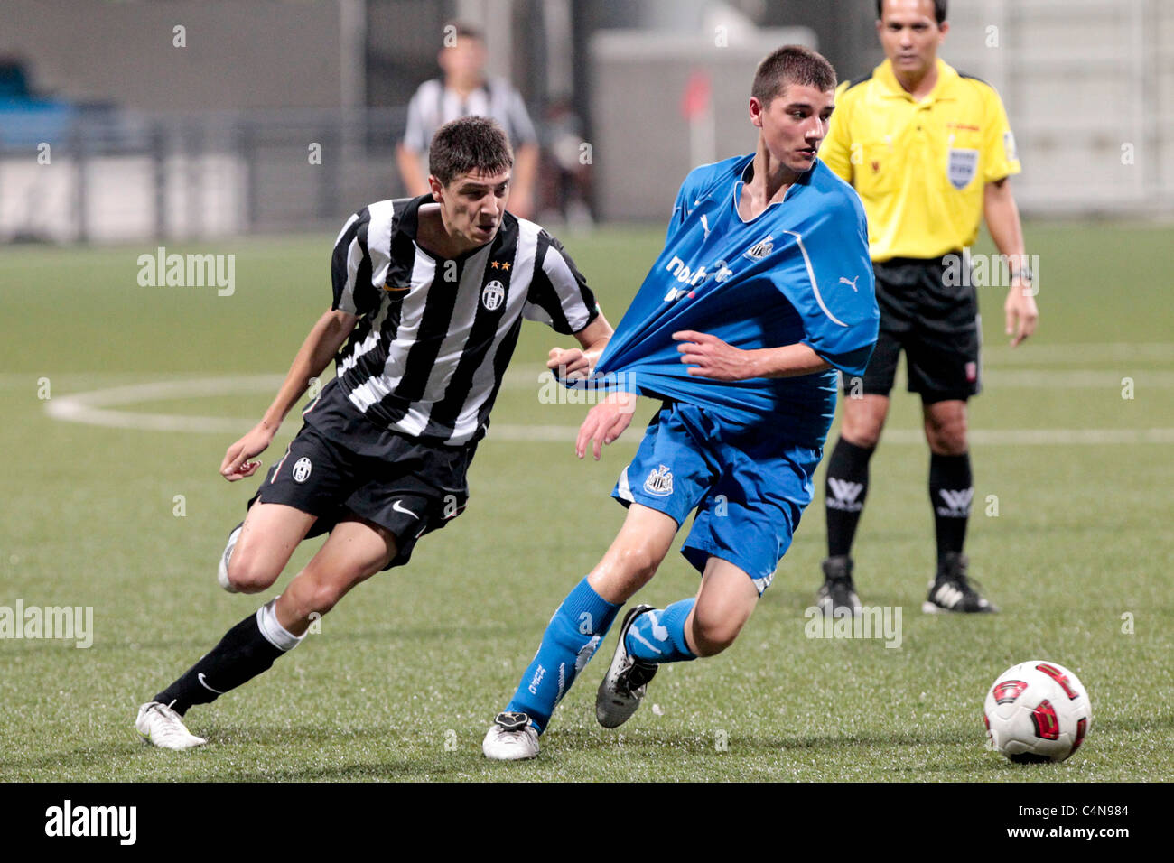 Jordan Storey of Newcastle United FC U15(right) turns Pagliasso Andrea  Giovanni during the 23rd Canon Lion City Cup Stock Photo - Alamy