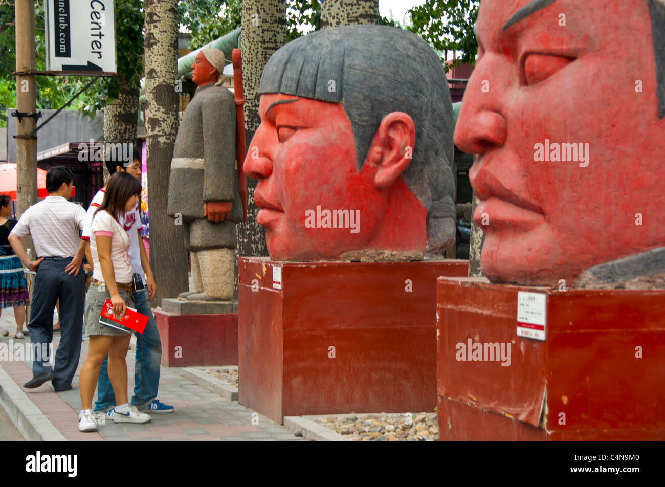 Beijing, China, Young people Visiting Art Galleries in 798 Dashanzi Art District, Outside Modern Sculpture, Chinese teenagers Stock Photo