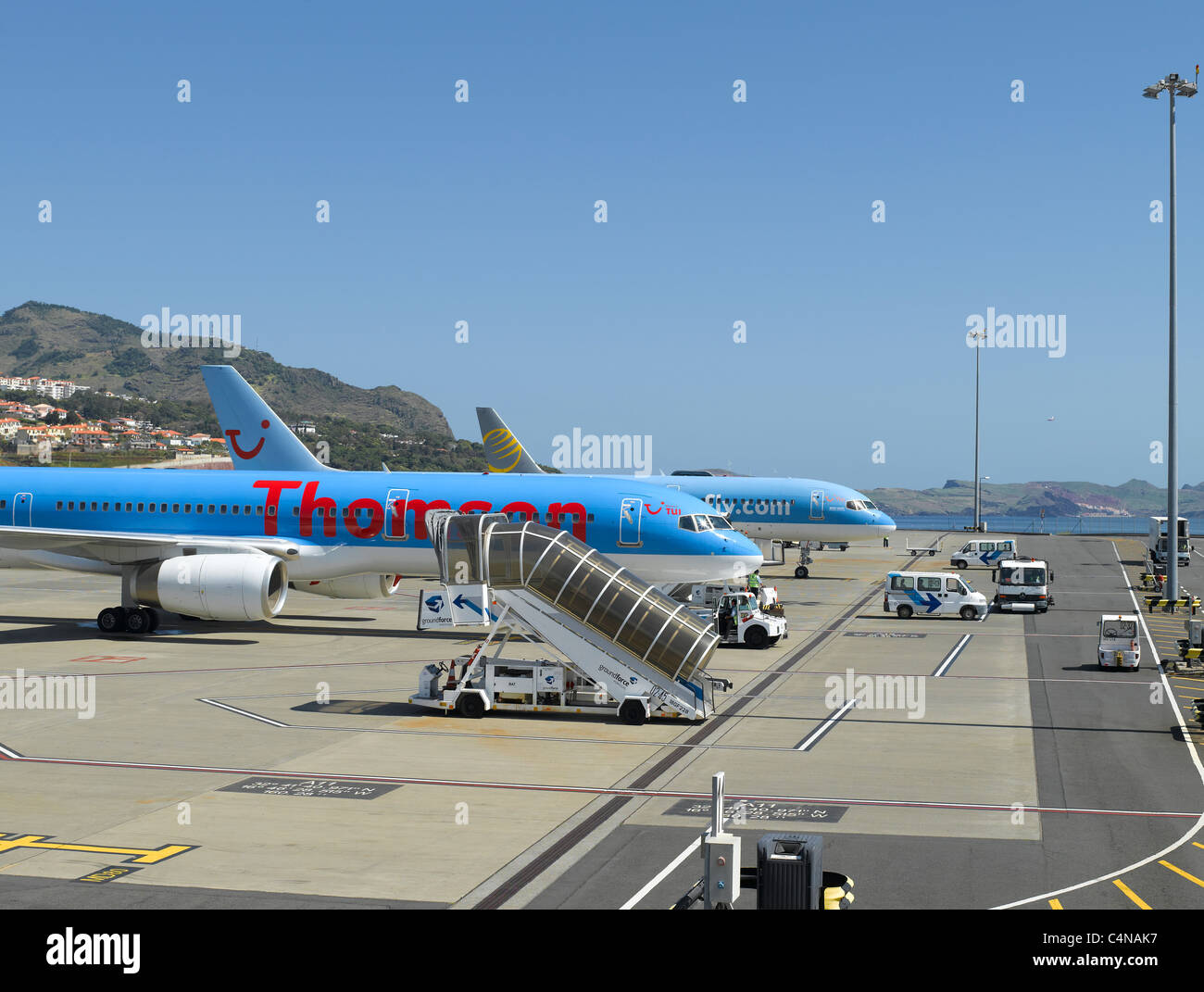 Thomson plane airplane planes airplanes parked at Funchal airport Madeira Portugal EU Europe Stock Photo