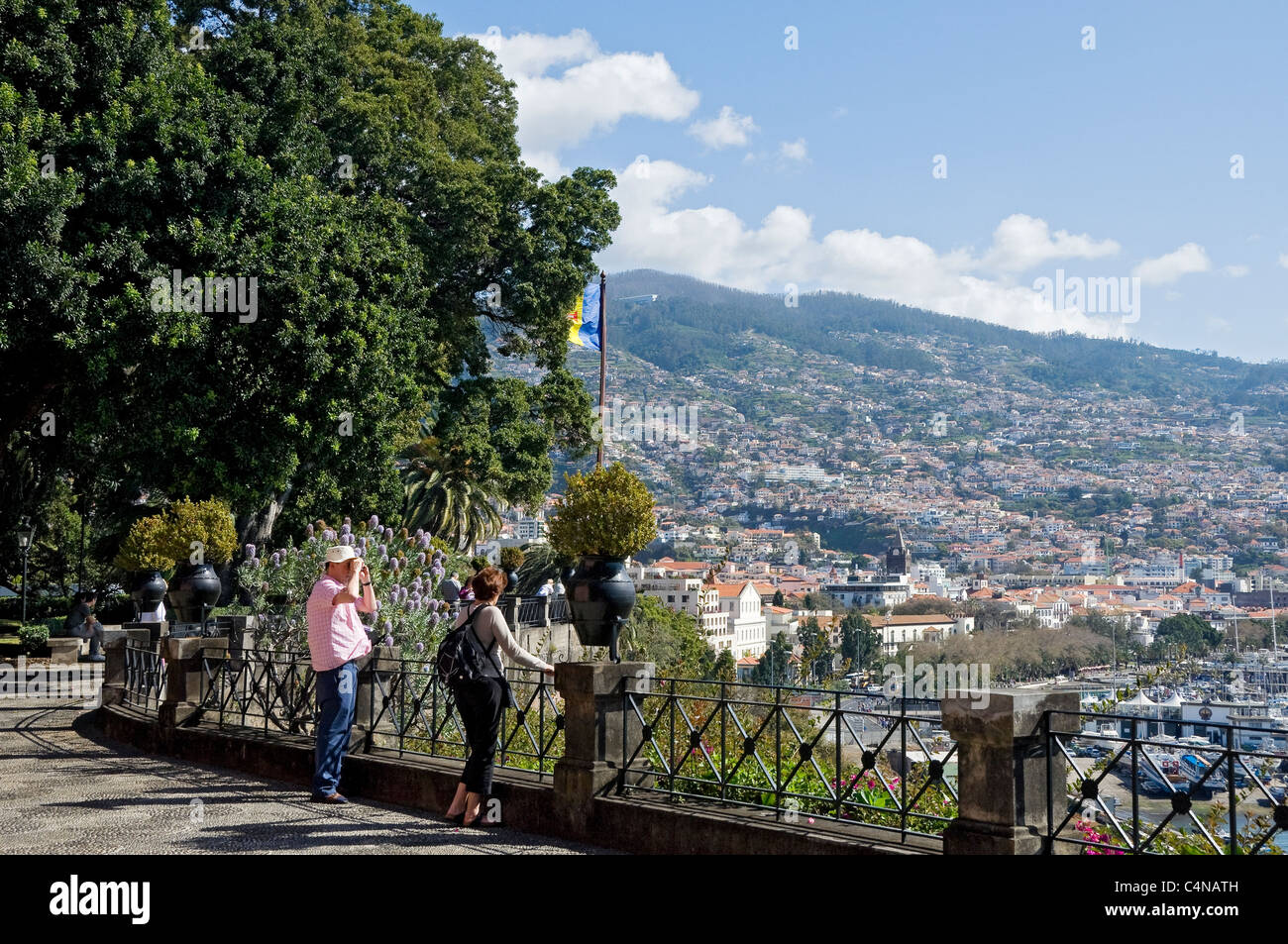 Visitors tourists people looking towards the City from the garden of the Governor's residence Funchal Madeira Portugal EU Europe Stock Photo