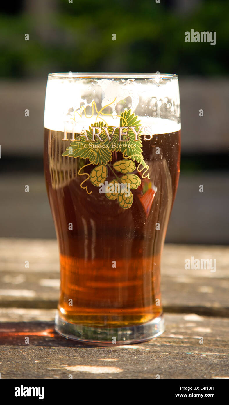 Close up pint glass of Harveys Sussex beer Stock Photo