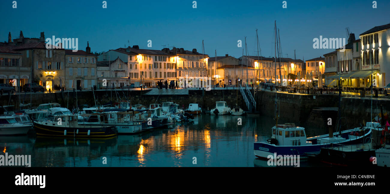 Harbour scene at dusk of Quai Job Foran, St Martin de Re on Ile de Re in France Stock Photo