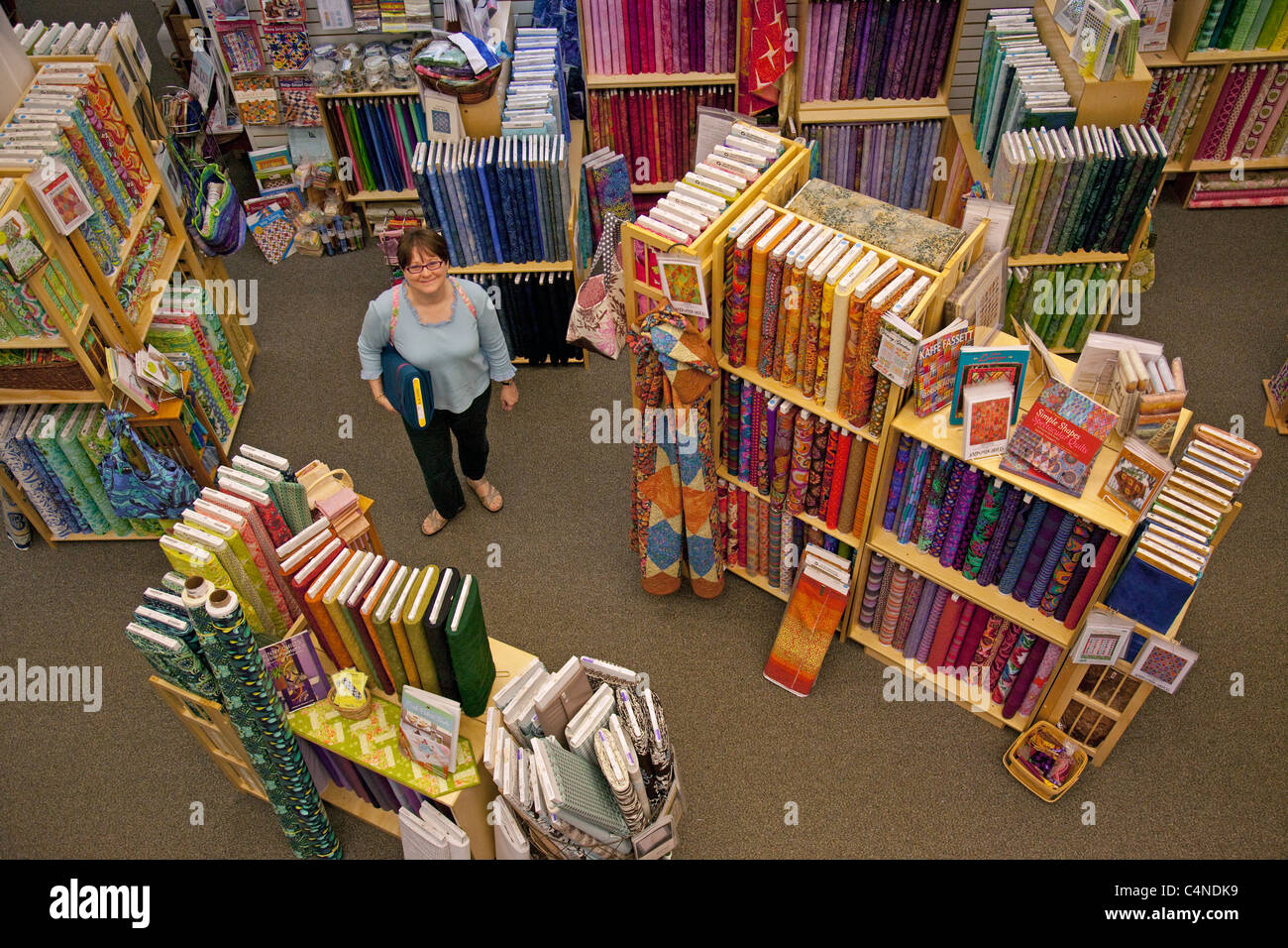 women in quilt store Stock Photo Alamy