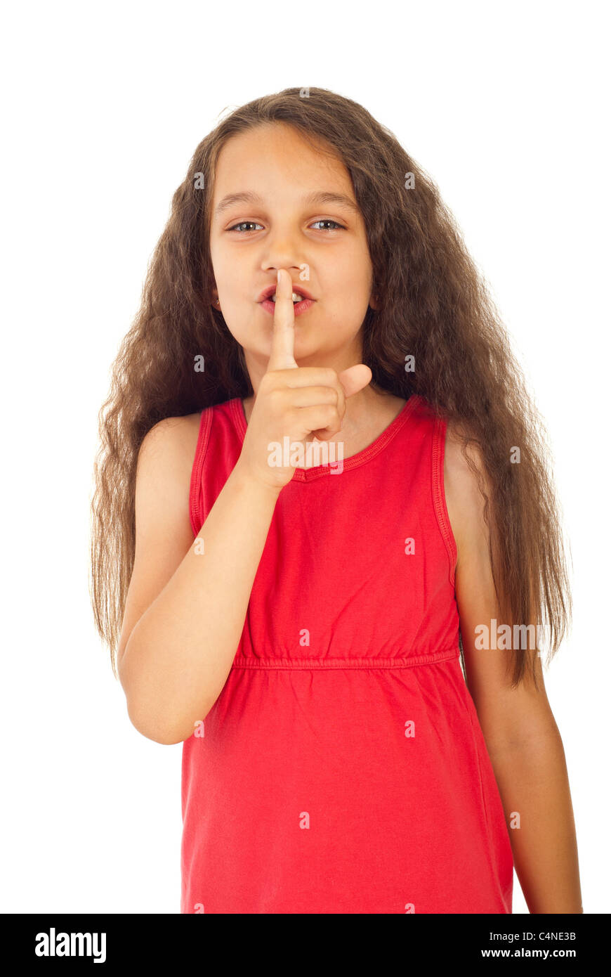 Little girl gesturing to be quiet isolated on white background Stock