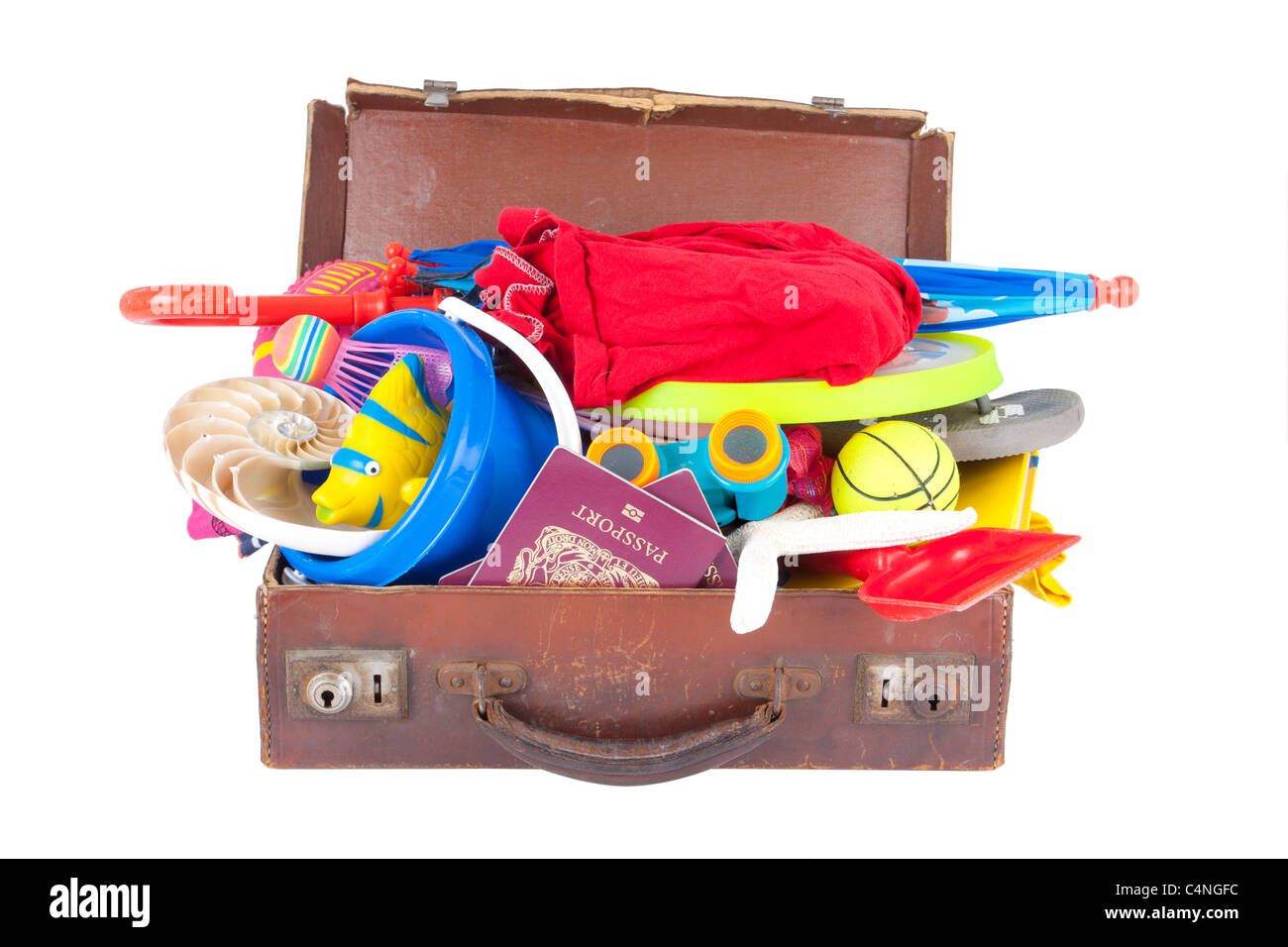 summer holiday beach and vacation suitcase packed full of clothes and toys Stock Photo