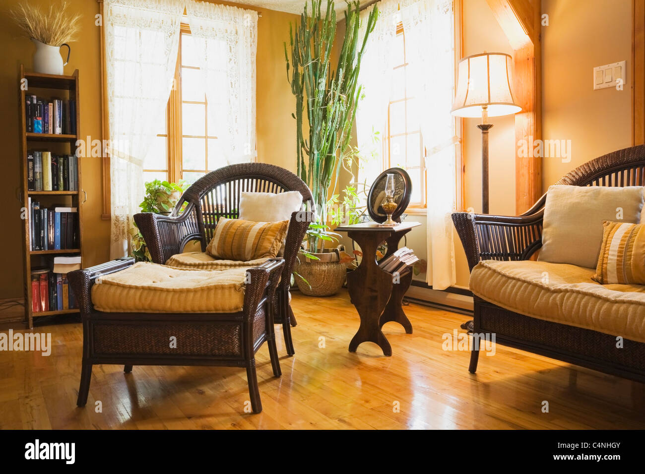 Wicker Furniture In Living Room Of 19th Century Cottage Style Home Stock Photo Alamy