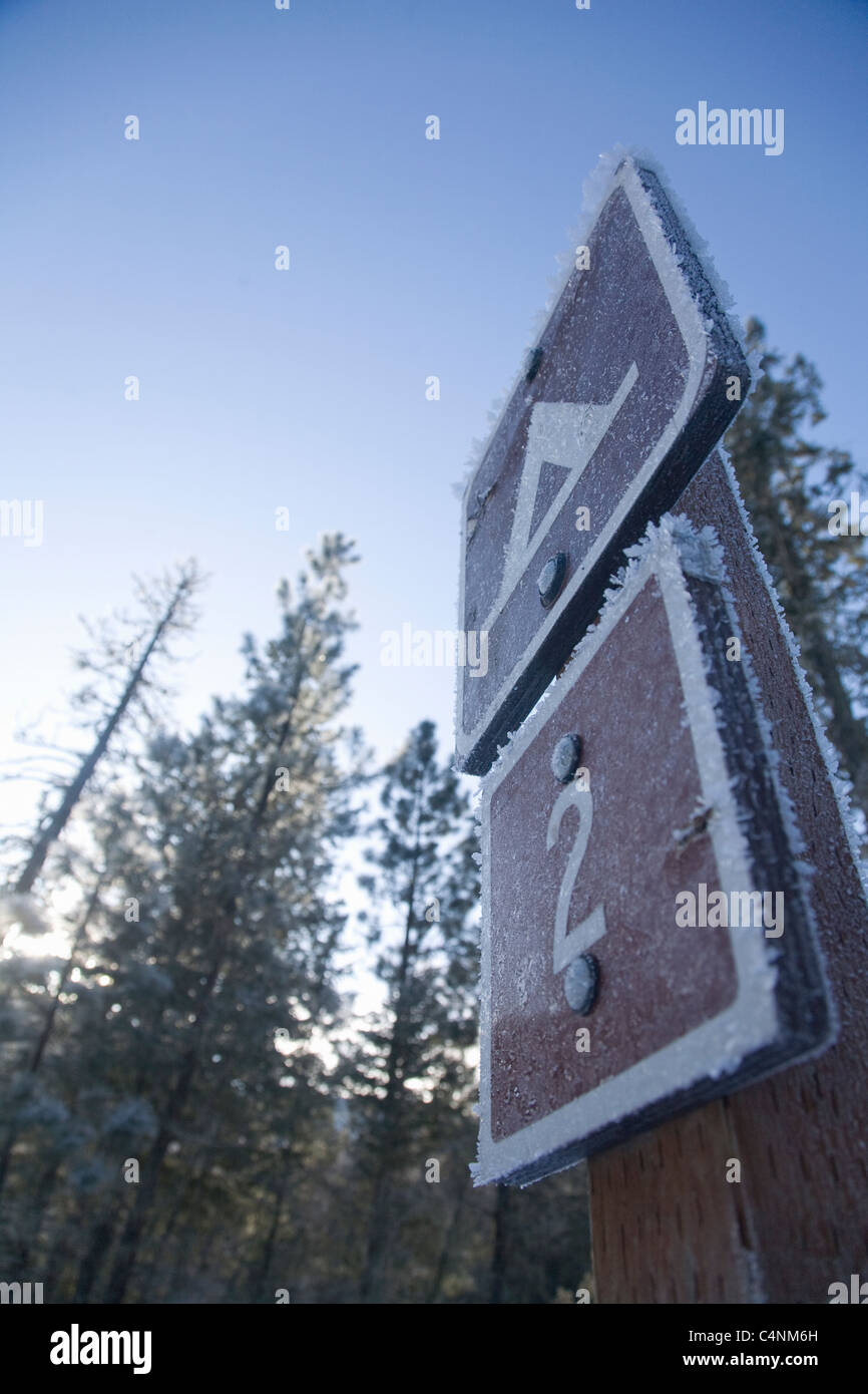 Forest service sign in winter, Rock Creek, Montana Stock Photo