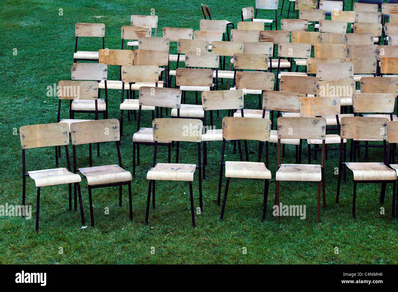 Wooden chairs arranged for outdoor concert Stock Photo