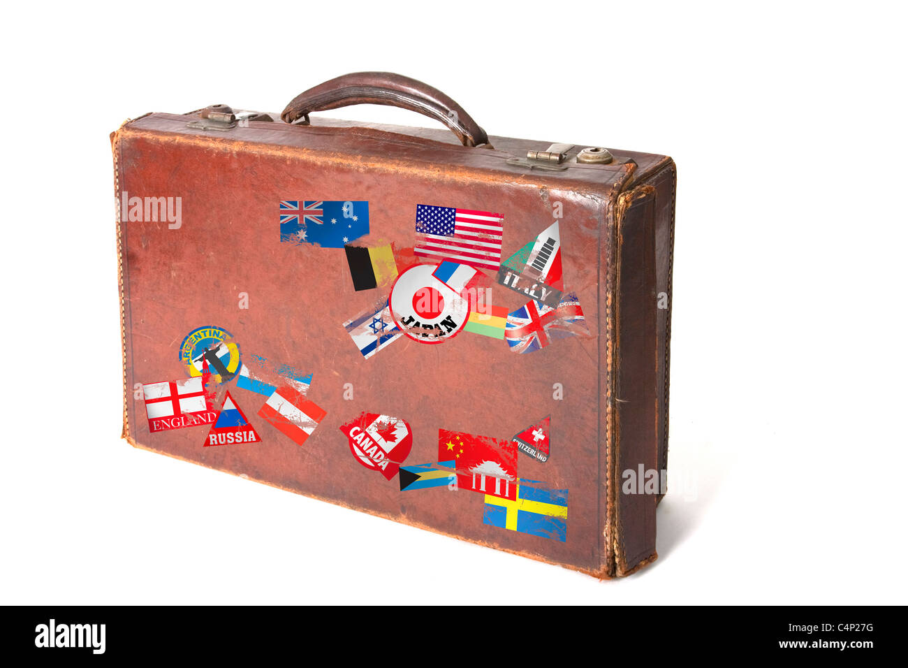 old vintage style suitcase with lots of stickers and flags from around the world on a white background Stock Photo