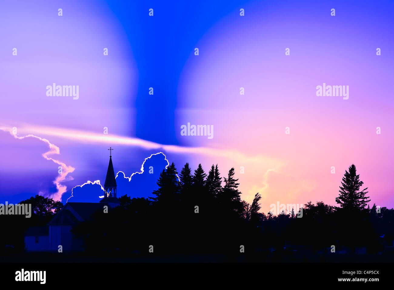 Storm clouds at sunset and silhouette of a church spire, NotreDamede