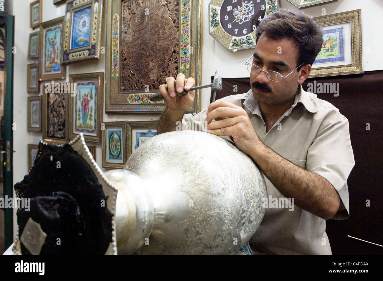 Artisan working in handicraft shop, Isfahan, Iran Stock Photo - Alamy