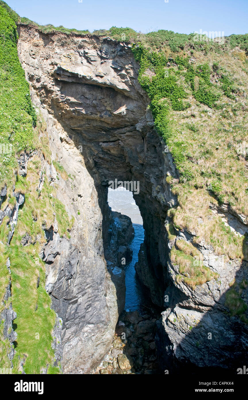 Natural arch known as Lundy Hole, a collapsed sea cave, on Cornwall's Atlantic coast Stock Photo