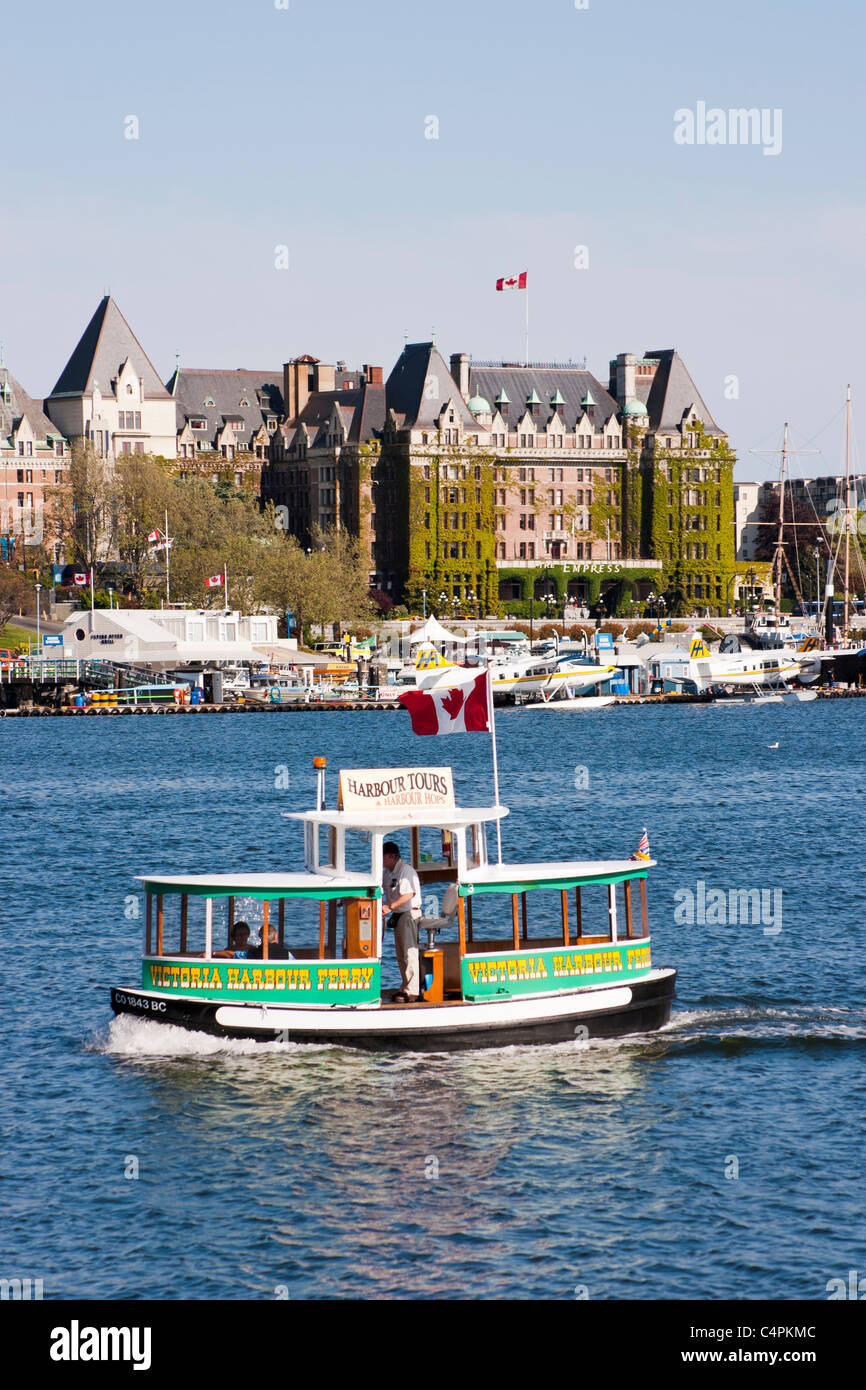 Victoria Harbour Ferry in front of Empress Hotel and Inner Harbour. Victoria, Vancouver Island, BC, Canada. Stock Photo