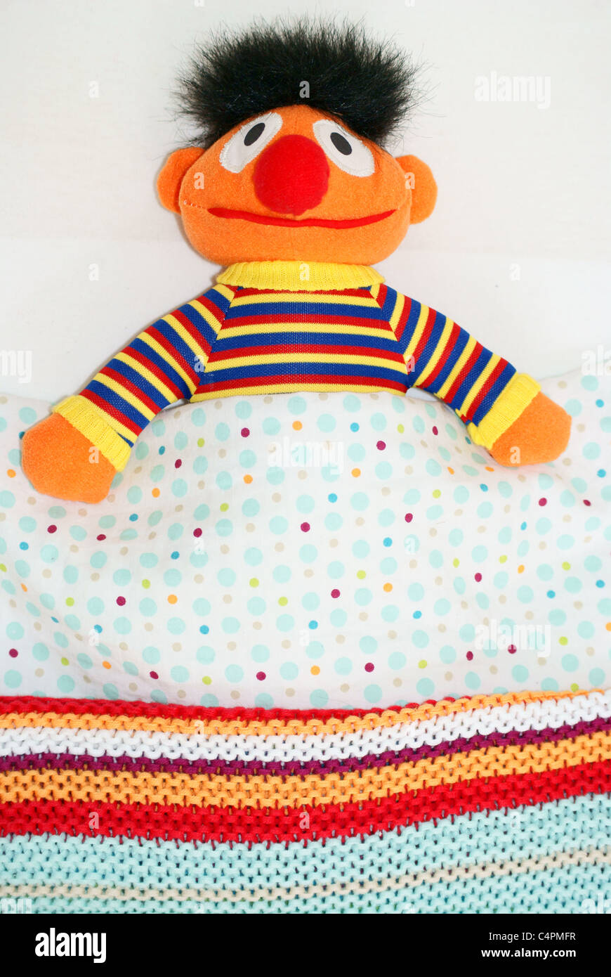 Bert, sesame street sleeping in bed Stock Photo