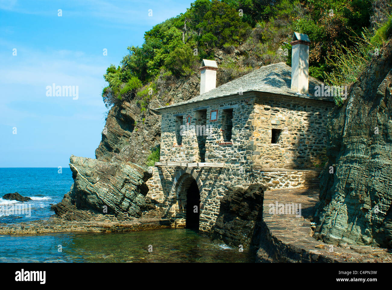 Traditional house on a beach, Greece Stock Photo