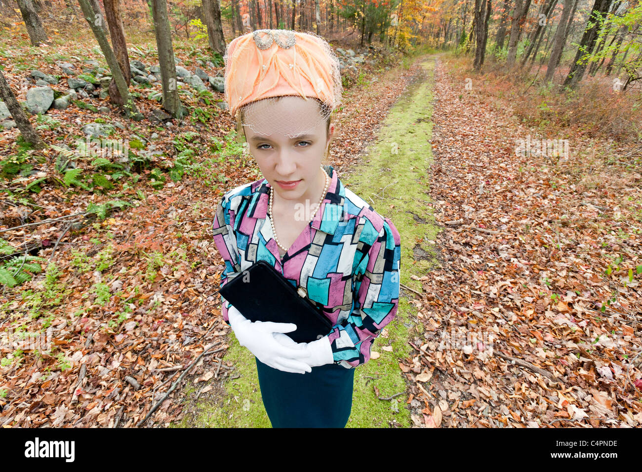Female teenager dressed as old lady. Stock Photo