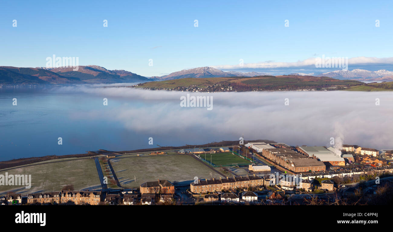 Winter haar drifting west on a lovely sunny afternoon passing Greenock towards Gourock and beyond Stock Photo