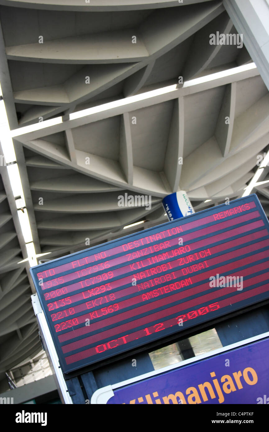 Departures board screen sign signs airport Stock Photo